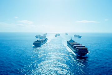 A fleet of container ships sailing in formation, representing Kubernetes deployments, shot on film: kodak porta 400