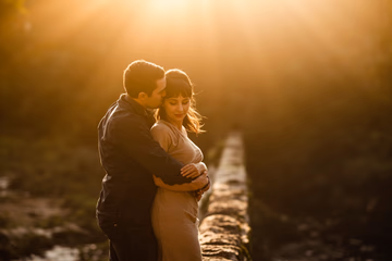 A couple reuniting on a bridge, symbolizing rekindled love and reconciliation.