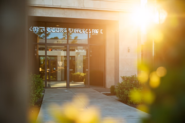A dental clinic entrance designed to attract international patients, featuring a clean and modern aesthetic.