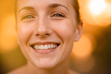A bright, healthy smile representing the positive impact of effective dental marketing on a dental practice's reputation.