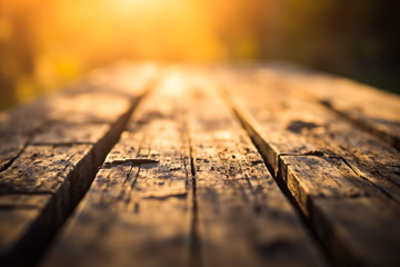 Photorealistic image of aged wood grain texture with a blurred background.