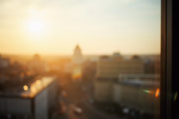 Berlin cityscape seen through a blurred office window, representing Rosenmeyer & Kollegen's local expertise.