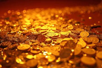 Conceptual image representing liquidity planning: a river of coins symbolizing cash flow.