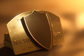 A shield protecting credit cards, symbolizing Stripe fraud prevention.
