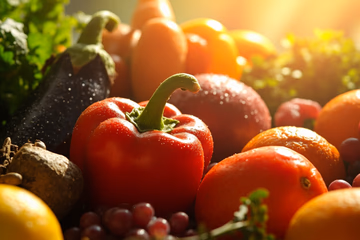 A wide shot of various colorful fruits and vegetables, representing the diverse components of food composition.